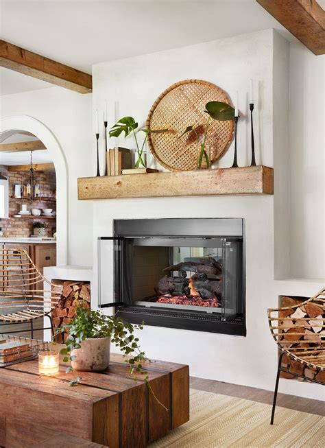Farmhouse joanna gaines fireplace - 3 – Vintage antique books are Joanna’s go to decoration. She uses them in all her fixer upper bedrooms she designs. Vintage books are so gorgeous right now stacked up or turned backwards so you see the old pages of the books. 4 – Throw pillows are ALWAYS used on every bed. The pillows are usually laid out like a triangle.